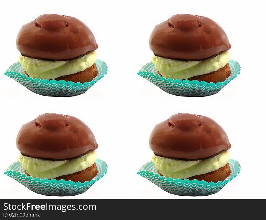 Cakes with cream and chocolate icing , isolated on a white background