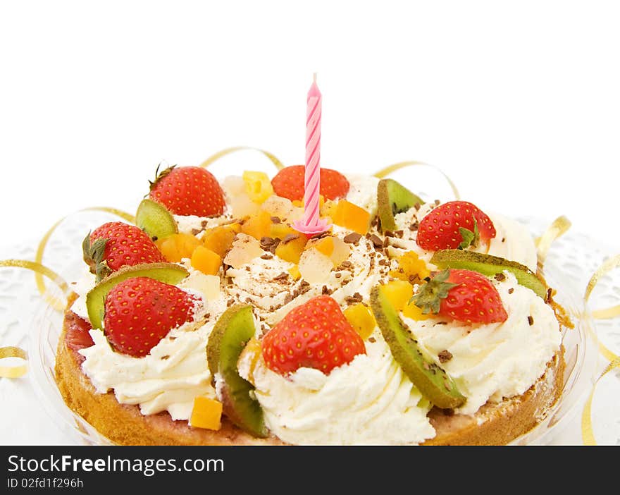 Celebrating a special day with fresh strawberry cake with candle and golden ribbons. Isolated over white. Celebrating a special day with fresh strawberry cake with candle and golden ribbons. Isolated over white.