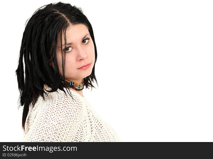 Portrait of young teenage girl with braided hair and face piercings, studio shot