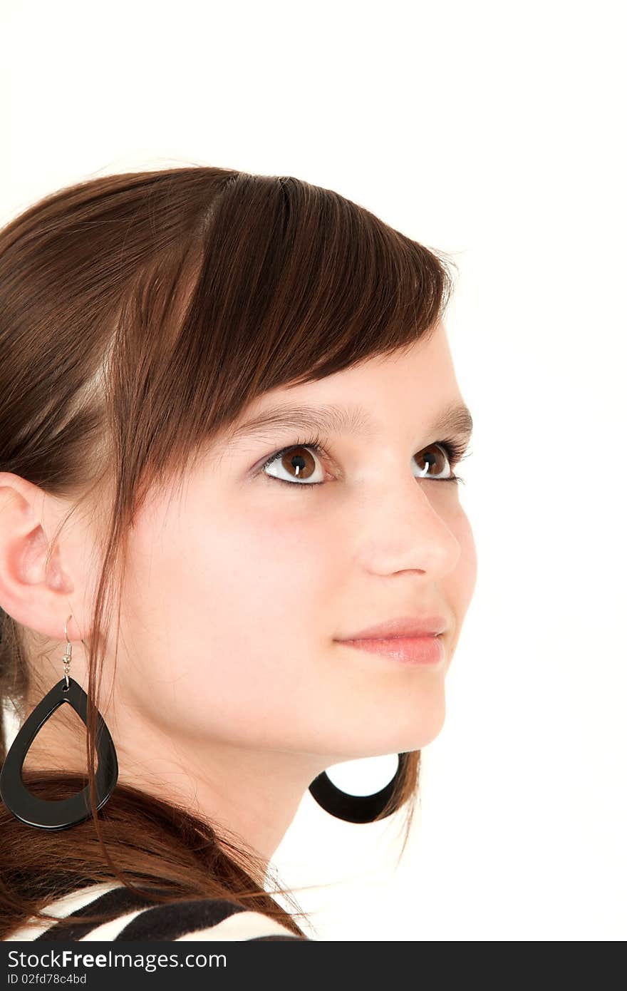 Portrait of young teenage girl looking up, studio shot