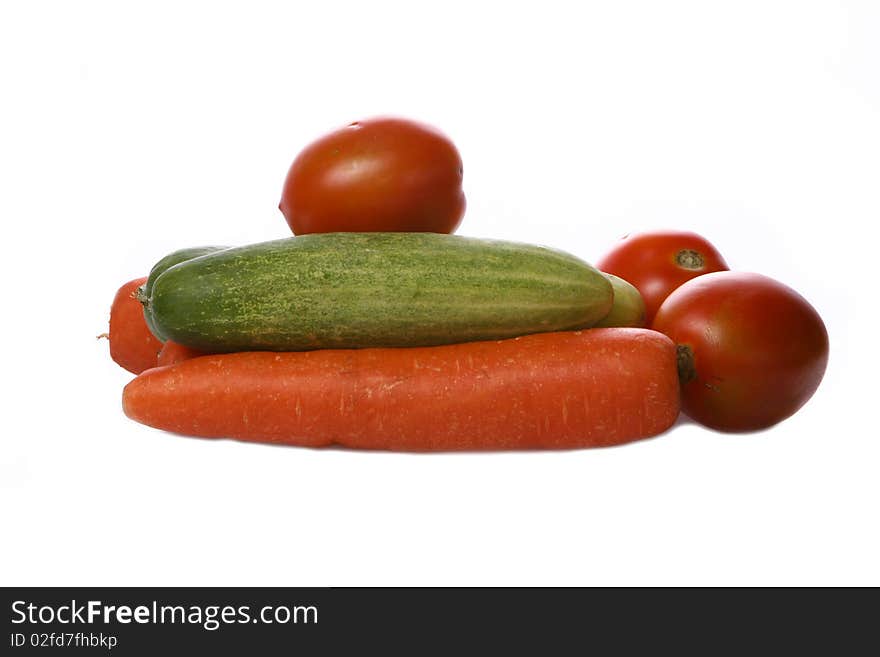 Tomatoes, cucumbers, and carrots for cooking vegetarian dishes. Tomatoes, cucumbers, and carrots for cooking vegetarian dishes.