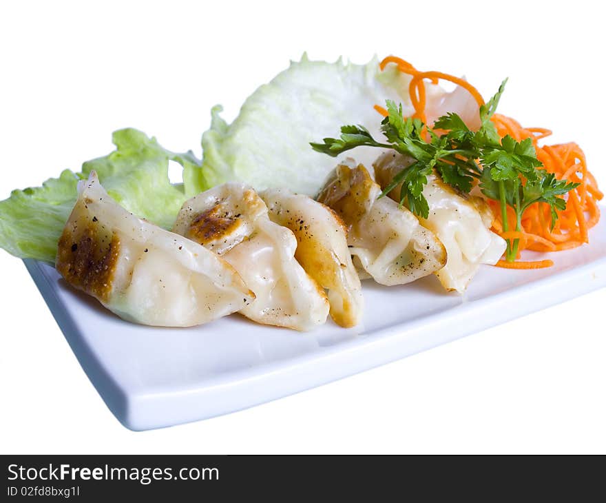 Pelmeni with a shrimp on a plate. Pelmeni with a shrimp on a plate