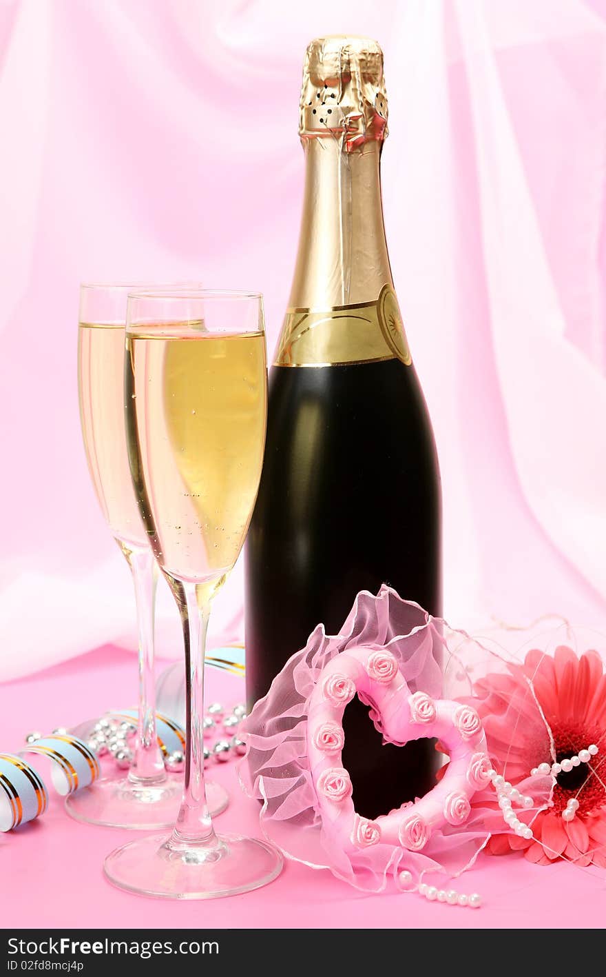 Bottle with a champagne and pink heart. Bottle with a champagne and pink heart