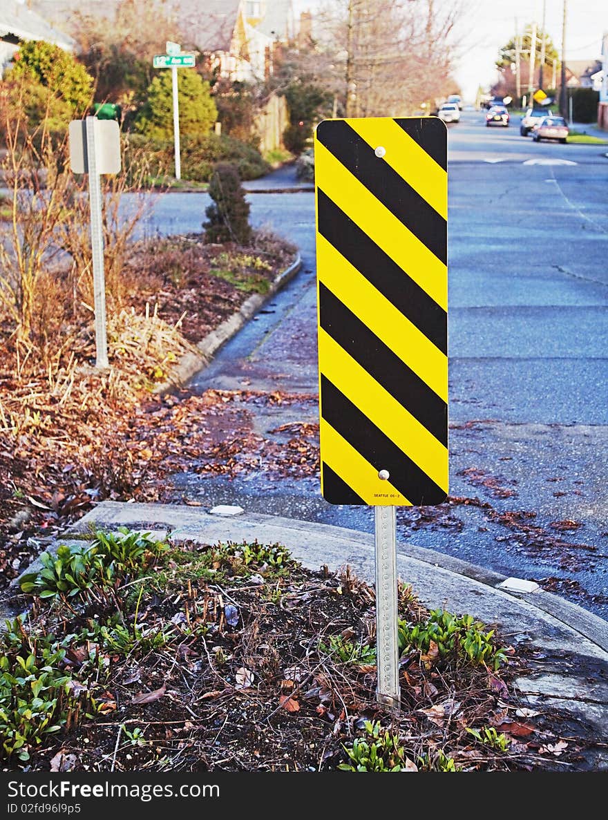 Caution sign placed within street berm. Caution sign placed within street berm