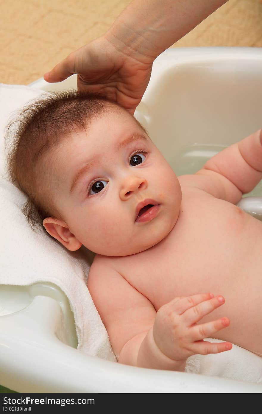 Baby taking bath