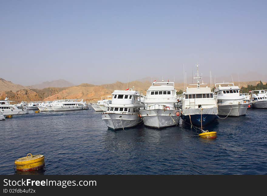 Boats are docked in the seaport of Egypt. Boats are docked in the seaport of Egypt.