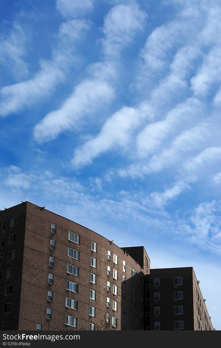 Interesting wavy clouds hover over apartments in lower manhattan. Interesting wavy clouds hover over apartments in lower manhattan