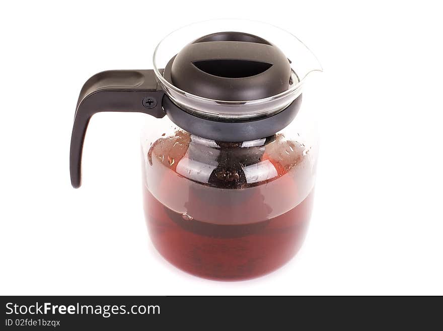 Series. A glass teapot isolated on a white background. Black tea