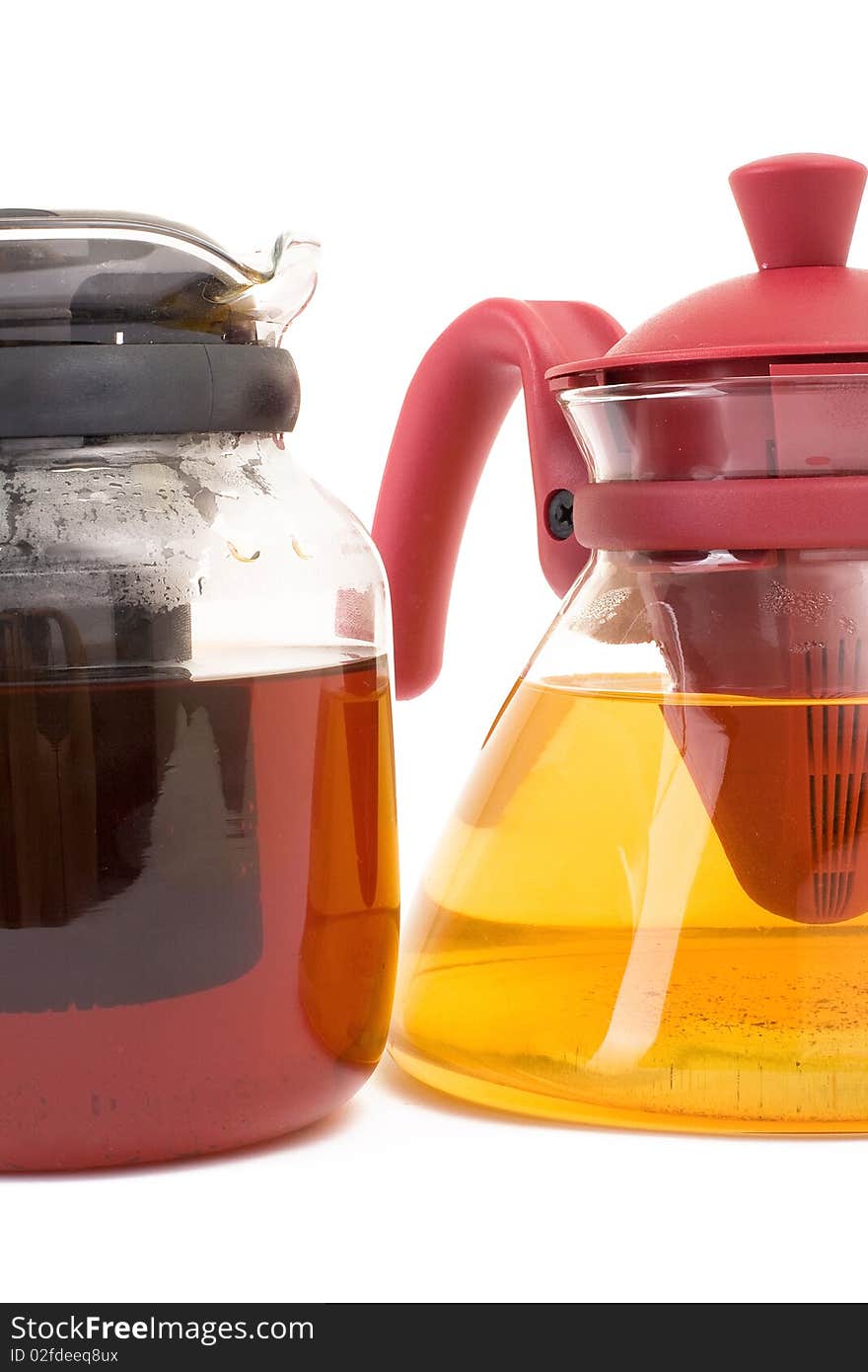 Series. A glass teapot isolated on a white background. Green and black tea