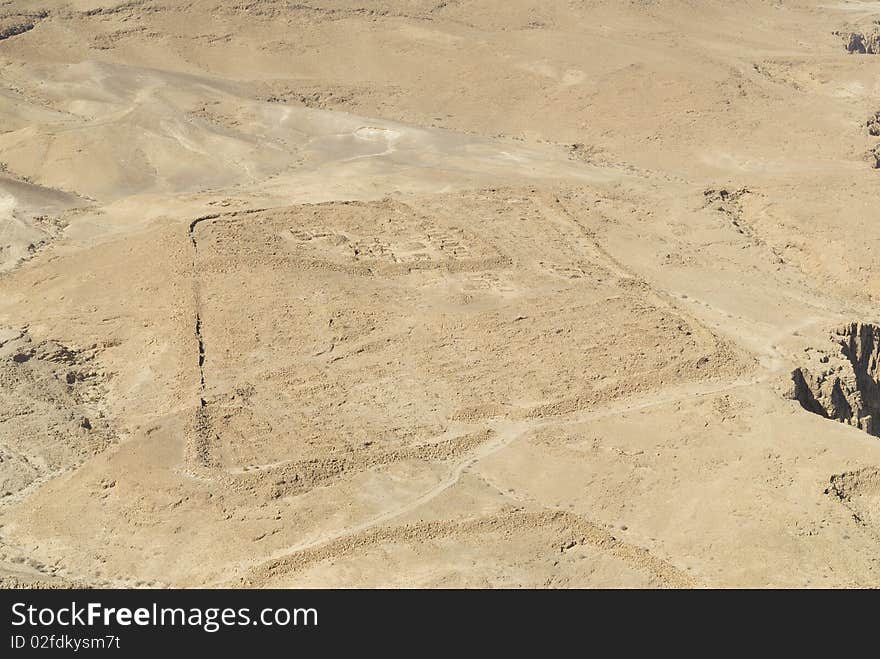 Roman encampment at the base of the ancient fortress of Masada in Israel. Built by King Herod the Great, Masada was used by the Jewish rebellion against the Romans. Roman encampment at the base of the ancient fortress of Masada in Israel. Built by King Herod the Great, Masada was used by the Jewish rebellion against the Romans