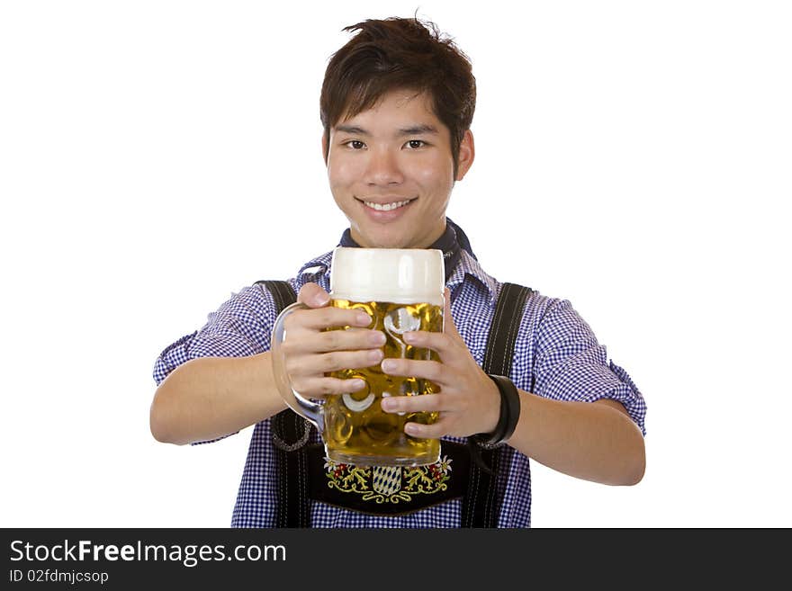 Asian man holding an Oktoberfest beer stein into camera and smiles happy. Isolated on white. Asian man holding an Oktoberfest beer stein into camera and smiles happy. Isolated on white.