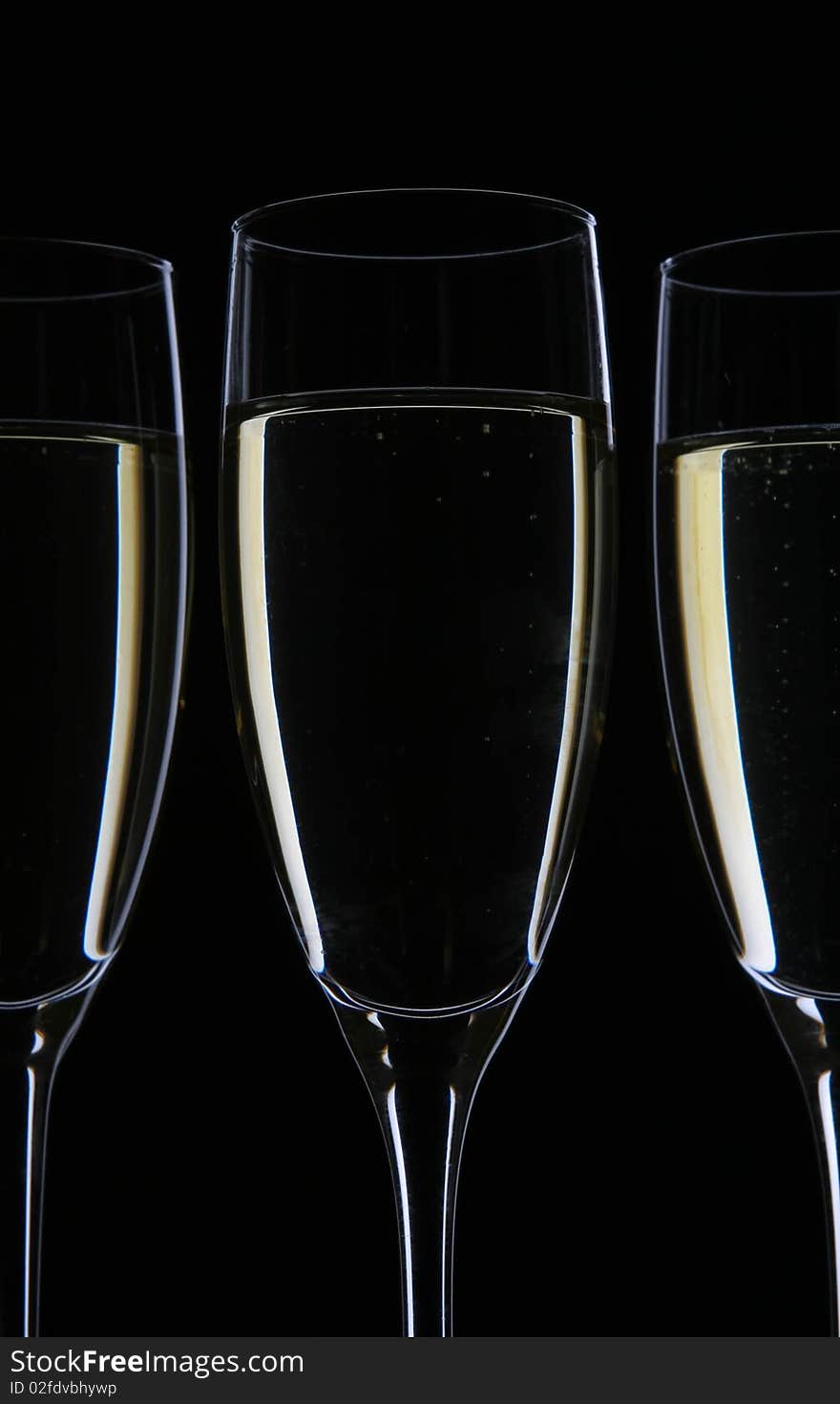 Champagne glasses on black with drink shape. Champagne glasses on black with drink shape