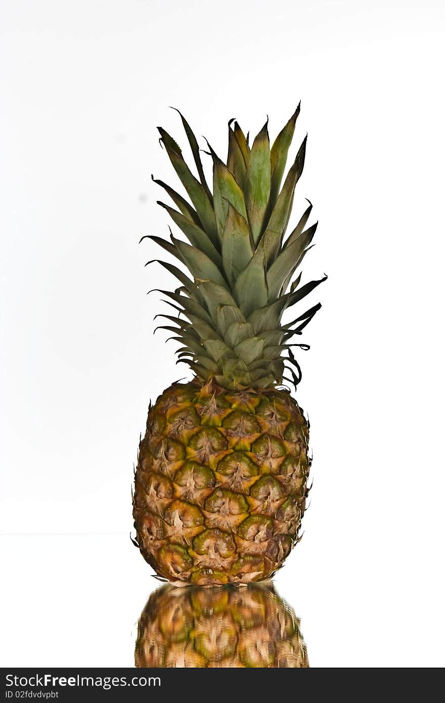 Pineapple with reflection on white for clip art