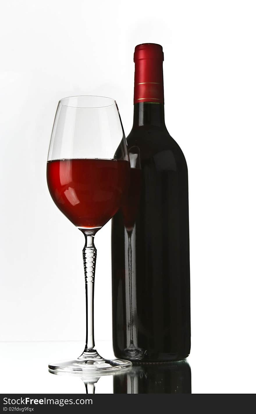 Red wine glass and bottle