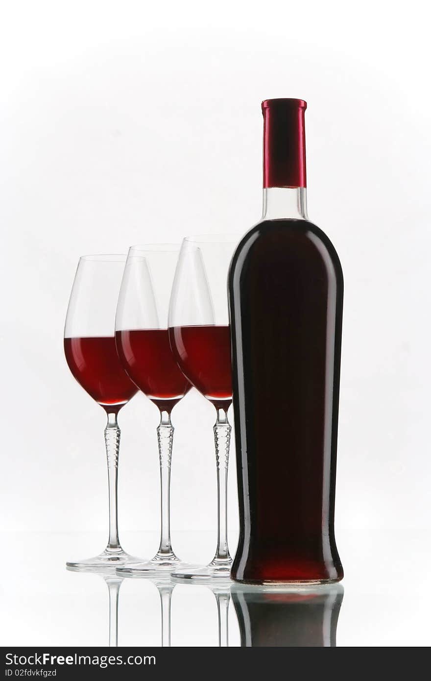 Red wine glasses and bottle