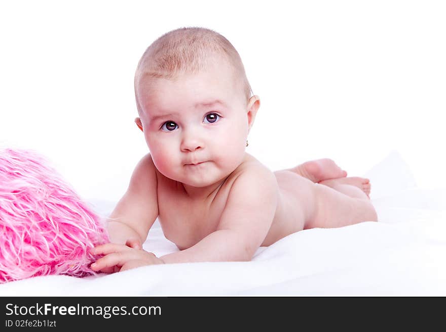 Beautiful baby with pink pillow on white background