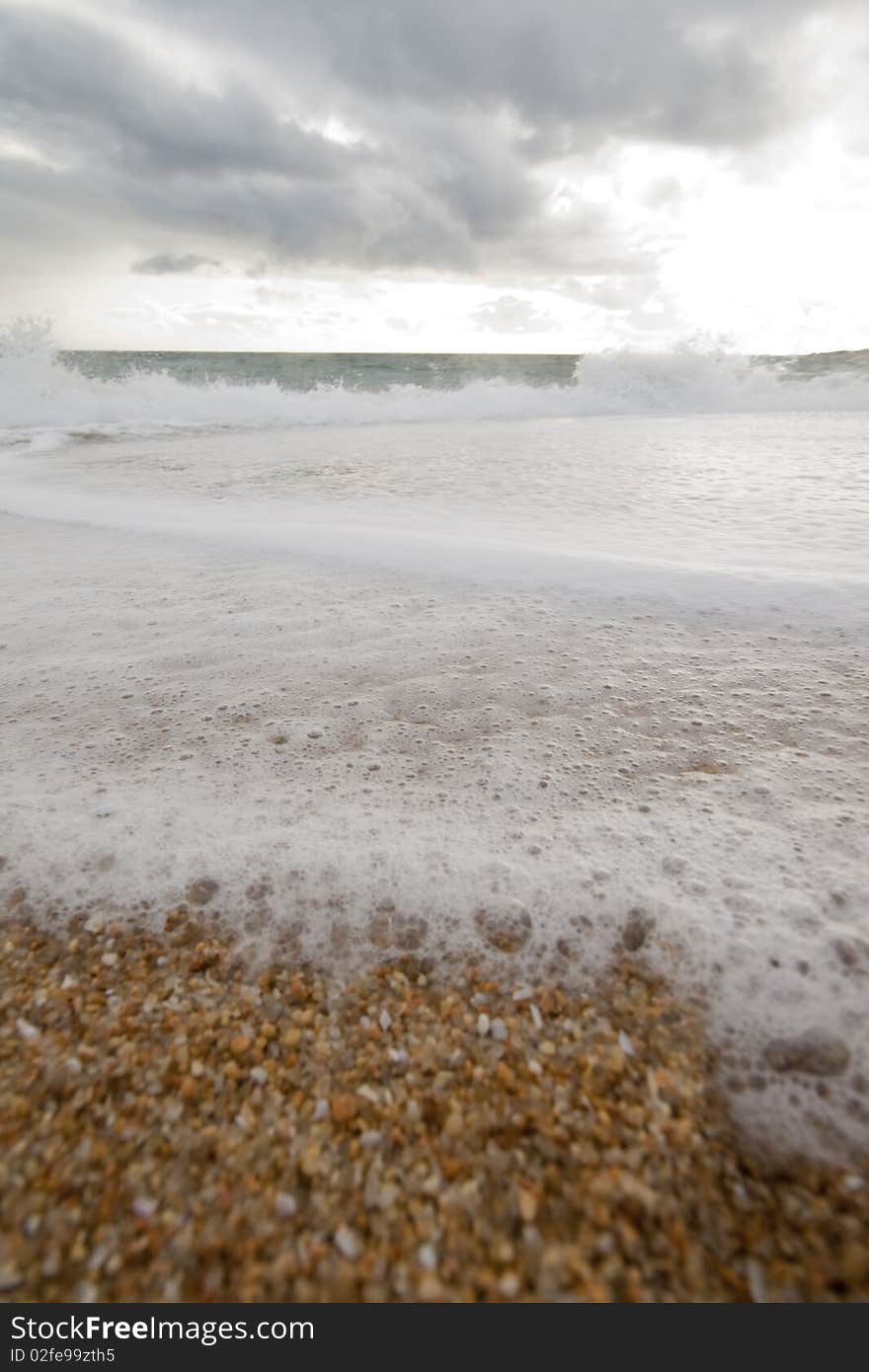 Sea wave on a cloudy beach. Sea wave on a cloudy beach