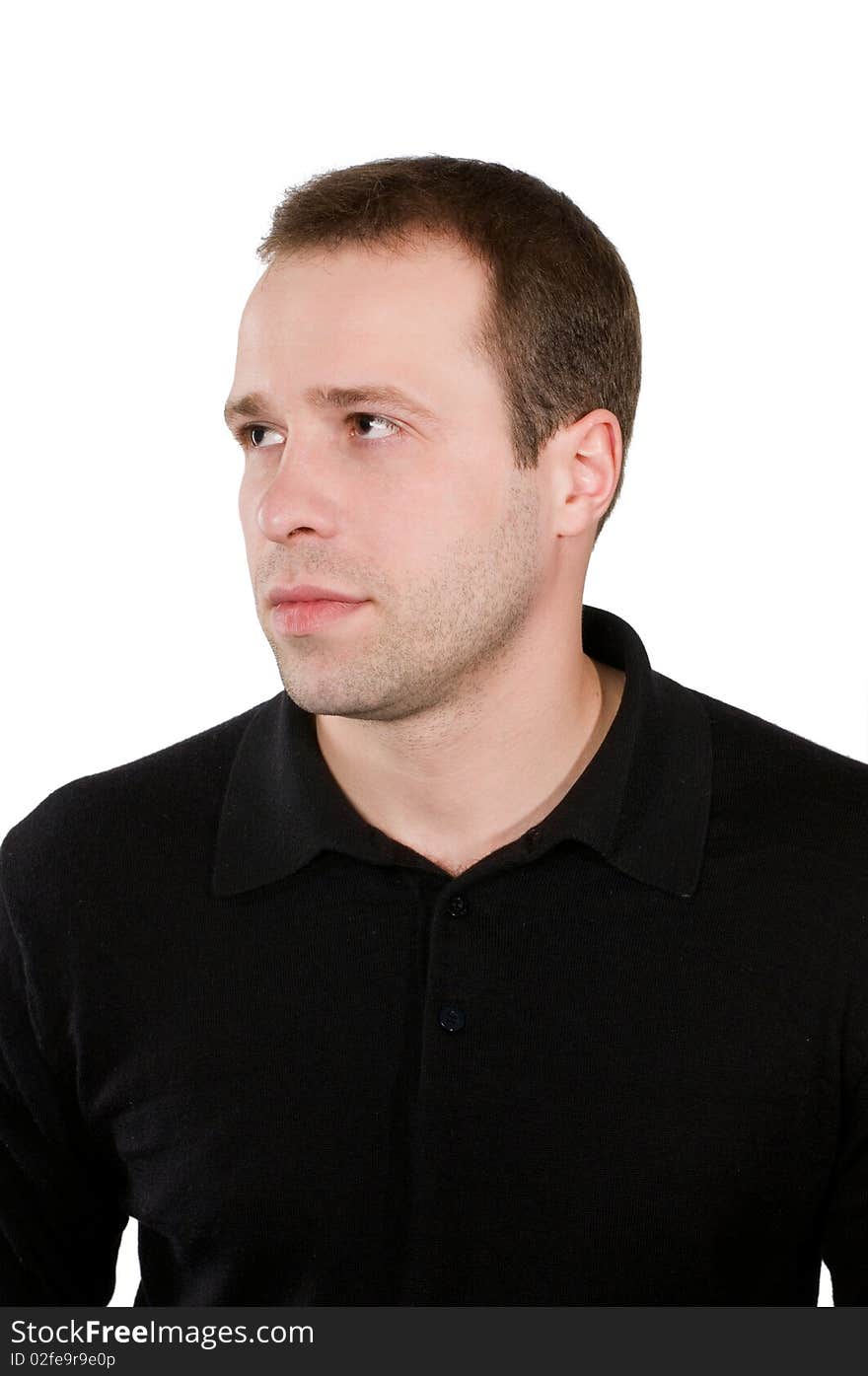 Portrait of the young man in a dark jumper, it is isolated on a white background.