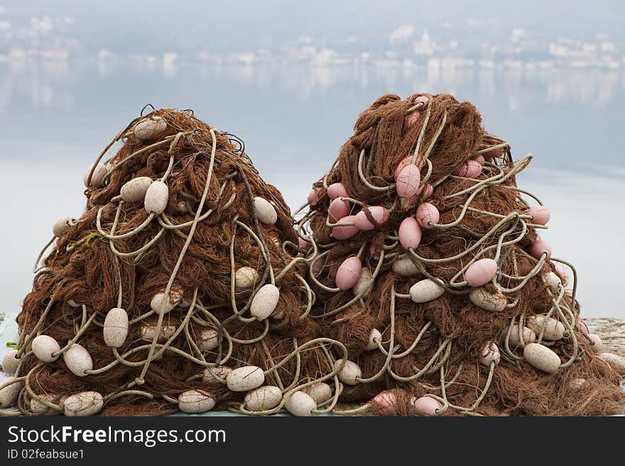 Two piles of fishing nets with floats. Two piles of fishing nets with floats