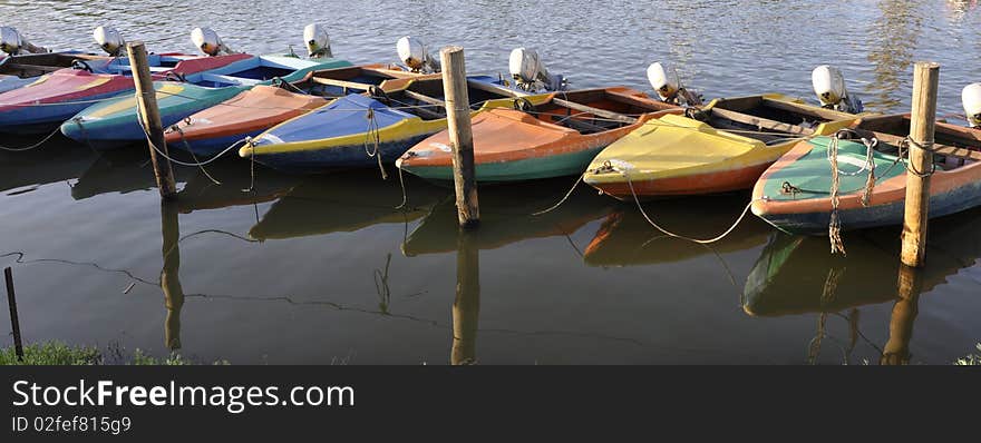 Motor boats tied at the end of day