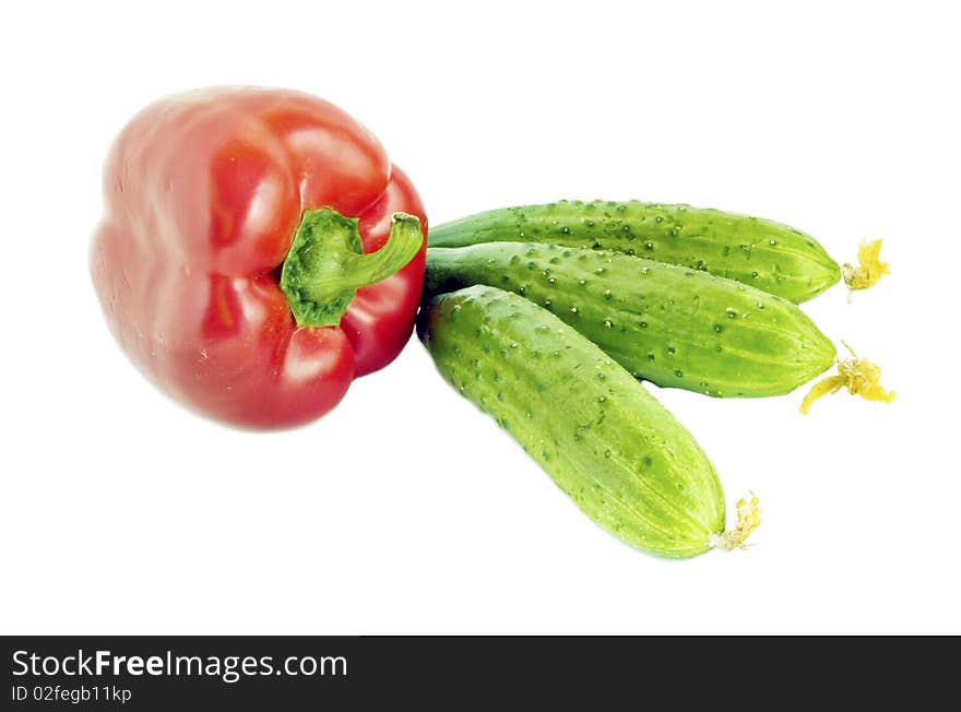 Bulgarian pepper and cucumber on a white background