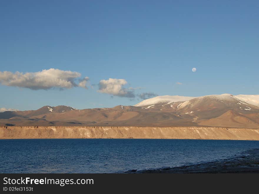 Moon in sky of Laguna verde, Atacama, chile