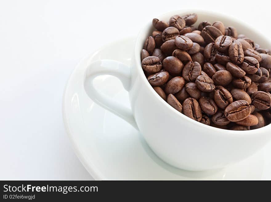 Coffee cup with coffee beans