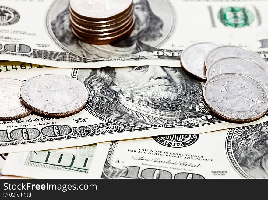 Closeup photo of coins over dollars background