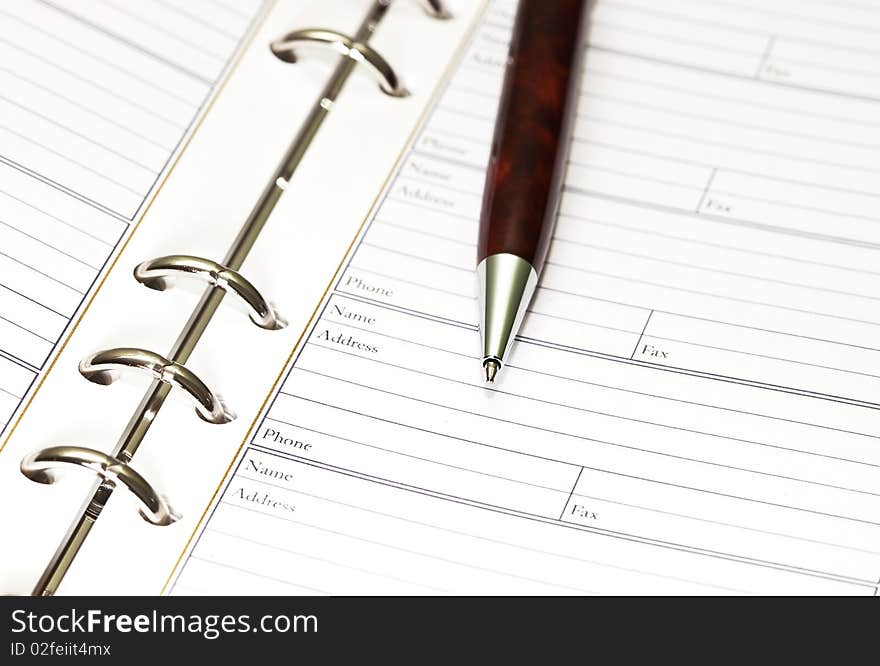 Macro of notebook and pen