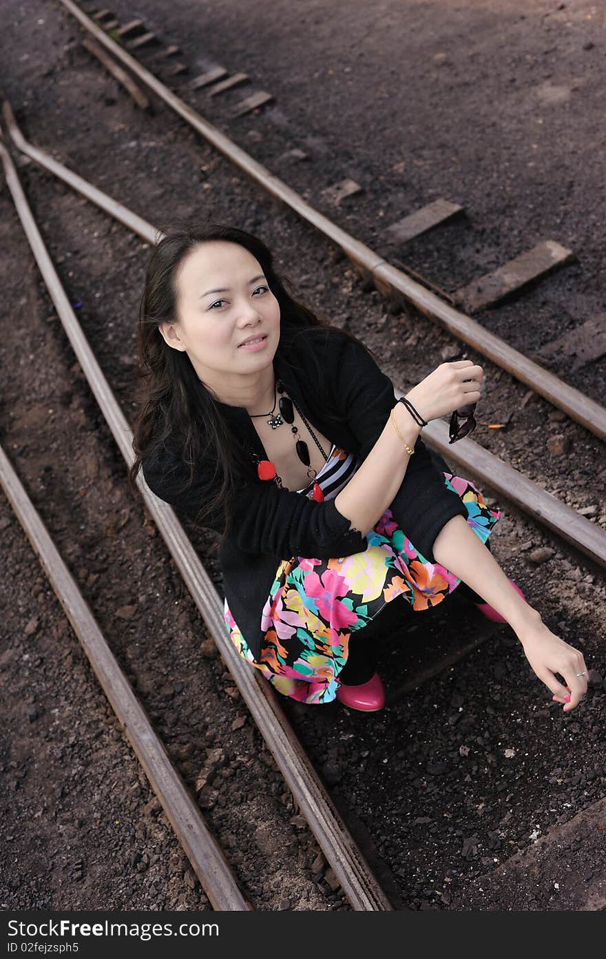 Asian girl sit on the rail. Asian girl sit on the rail.