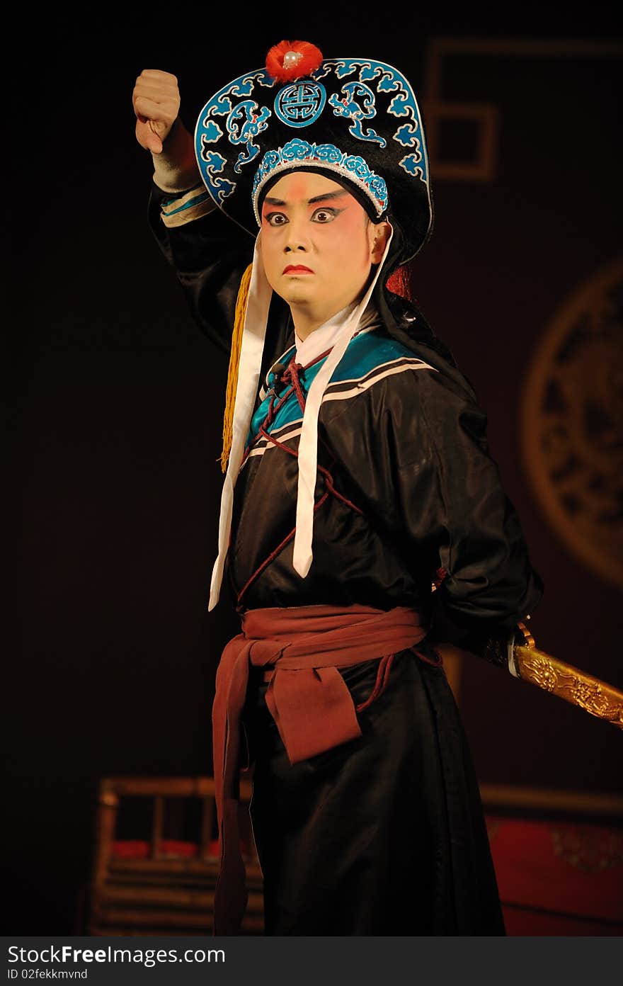 China opera actor with hat and sword.