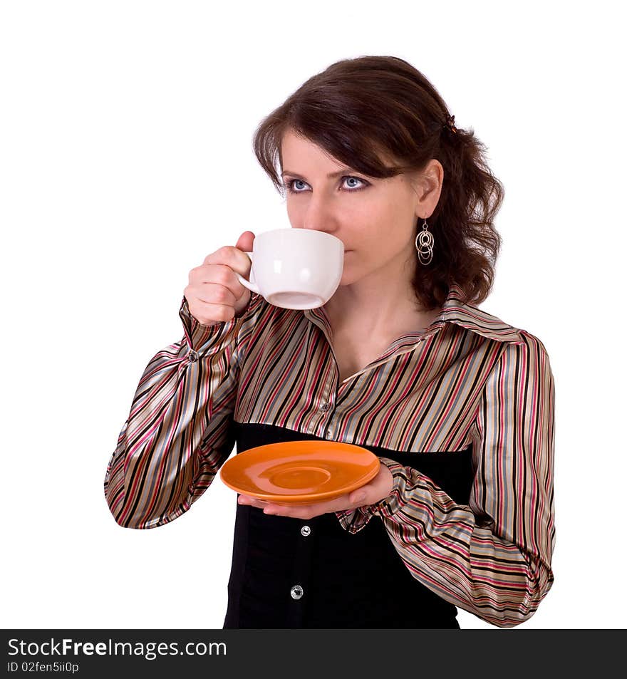 The nice girl drinks tea from a white cup. The nice girl drinks tea from a white cup