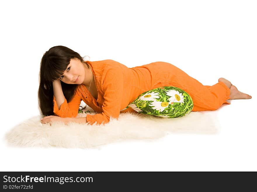 A pregnant woman lying on a pillow