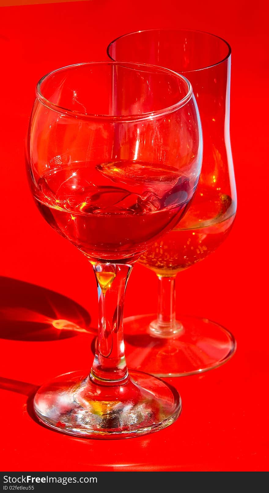 Red wine glass isolated on a blue background