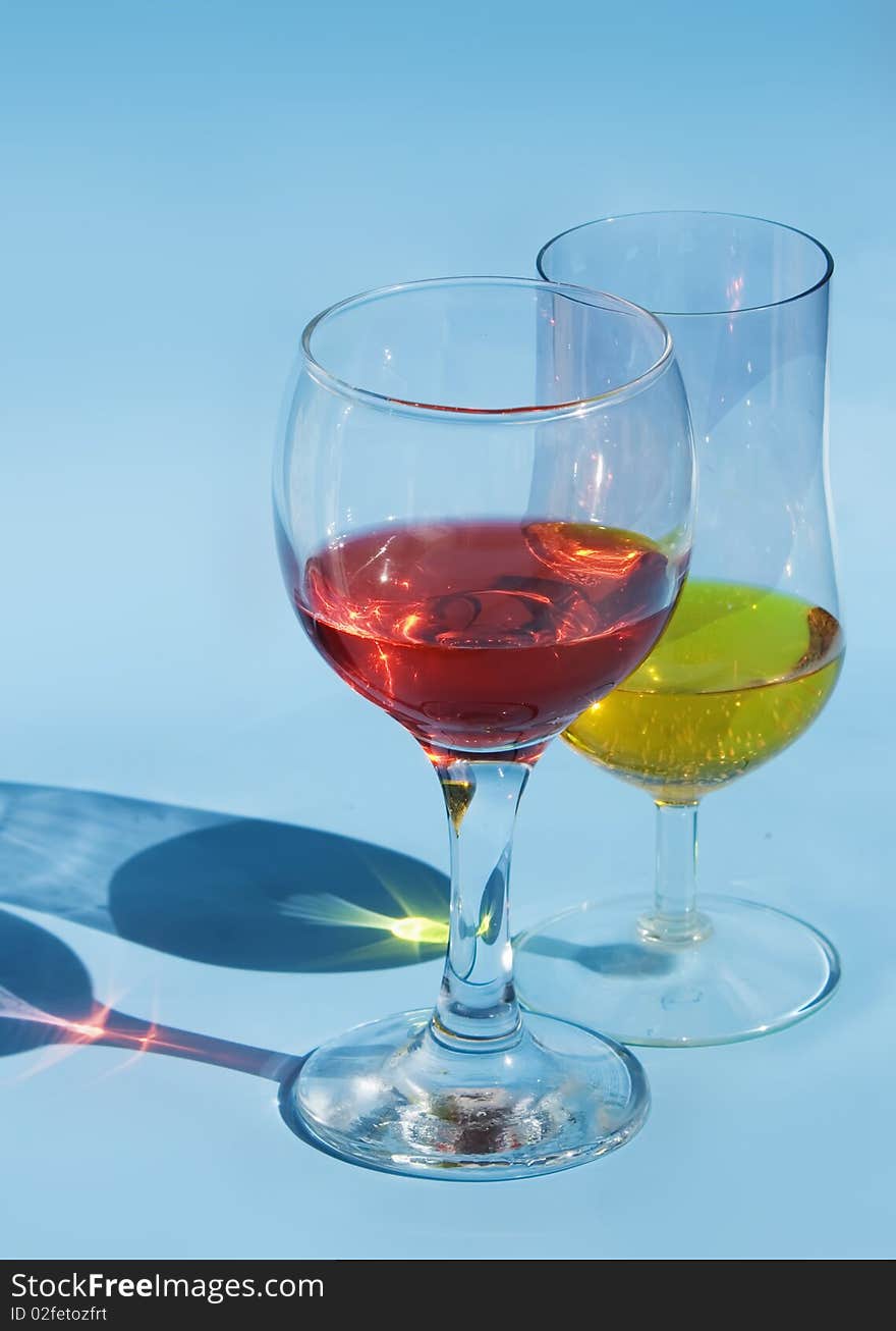 Red wine glass isolated on a blue background