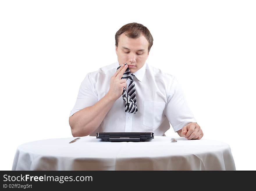 Businessman is wiping mounth with tie after lunch. Businessman is wiping mounth with tie after lunch