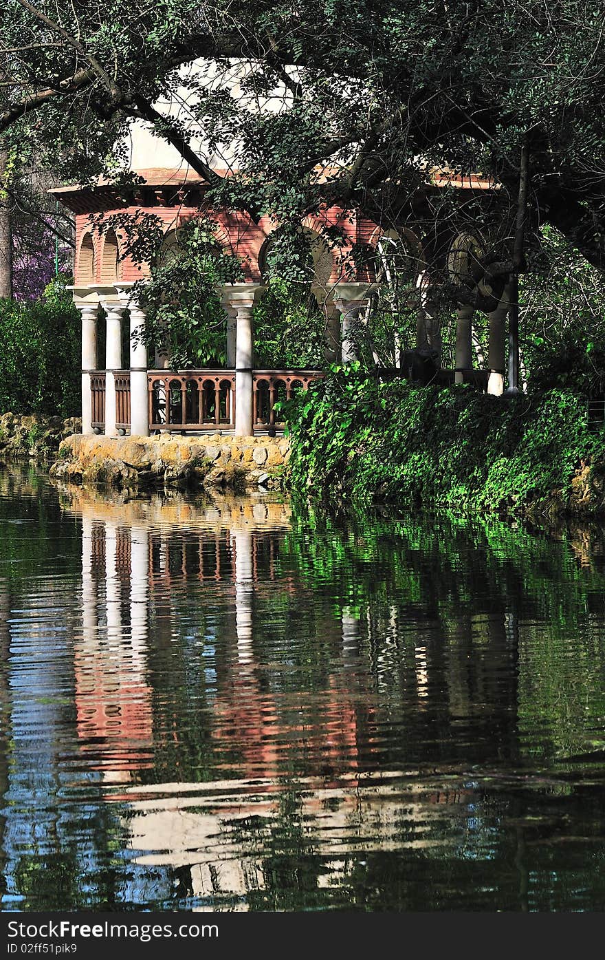 Reflection in an pond. Jardines de Alcazar.Sevilla,Andalucia,Spain