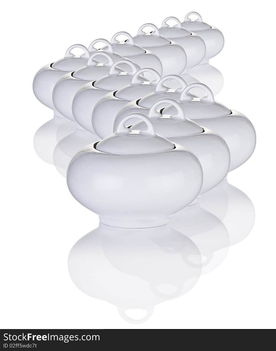 White Sugar Bowls Arranged In A Pattern