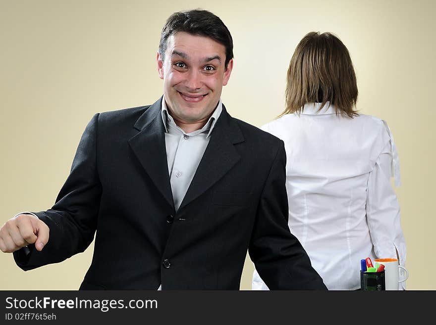 happy business man having fun in office, upset colleague in background