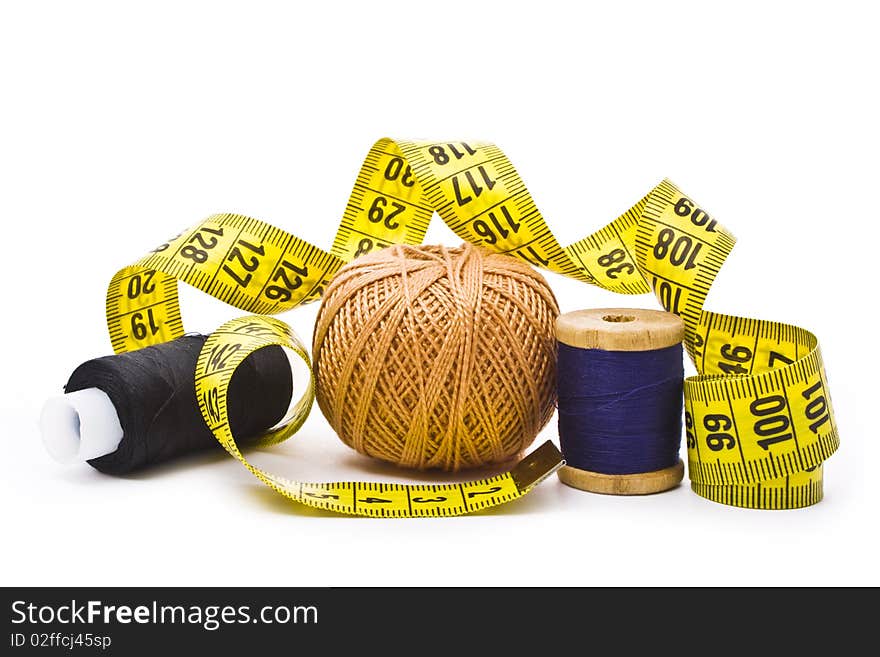 Colorful thread with measuring tape isolated in white