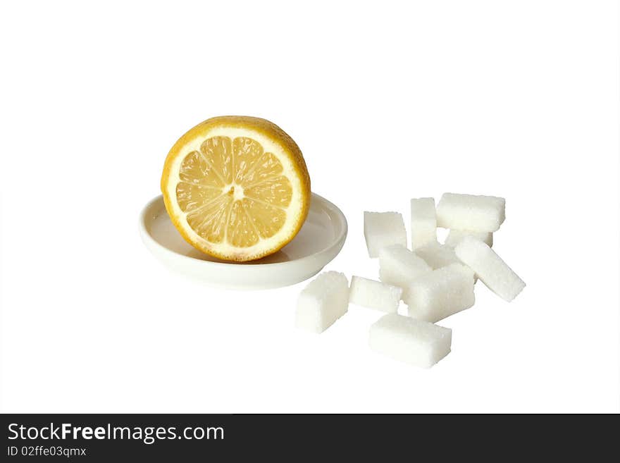 Lemon and sugar on white background