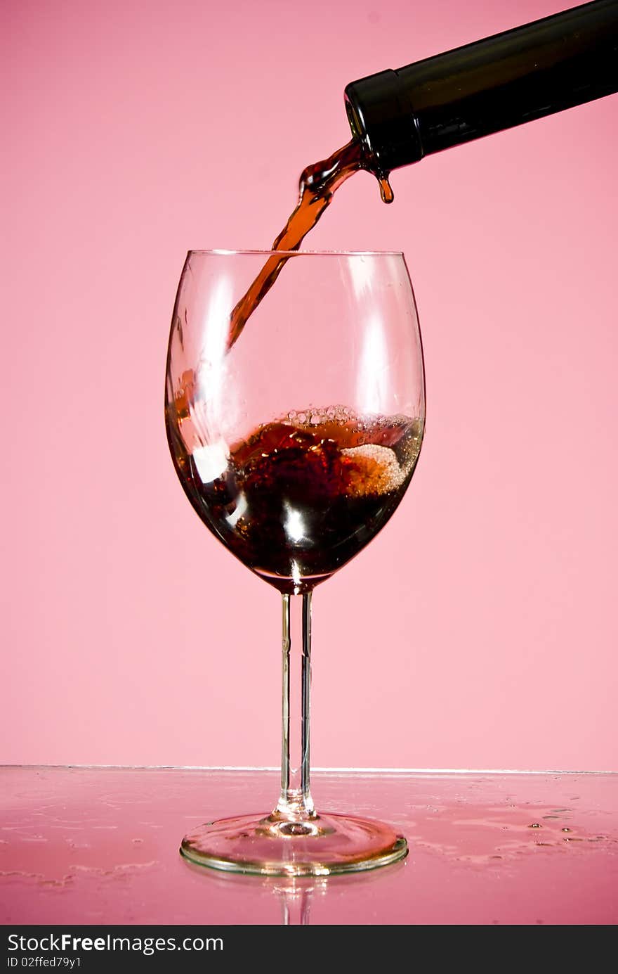 Red wine poured into glass