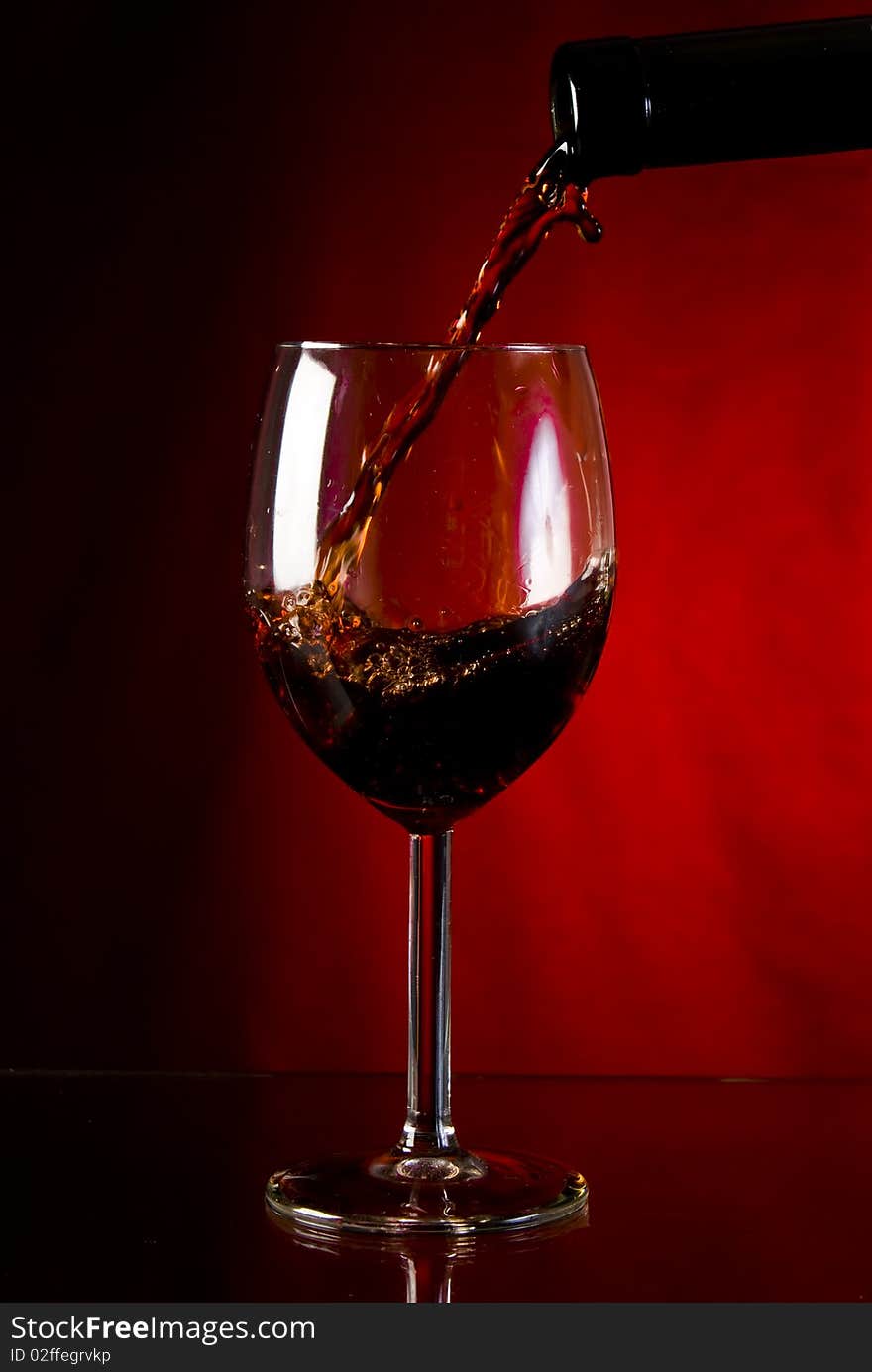 Red wine poured into glass