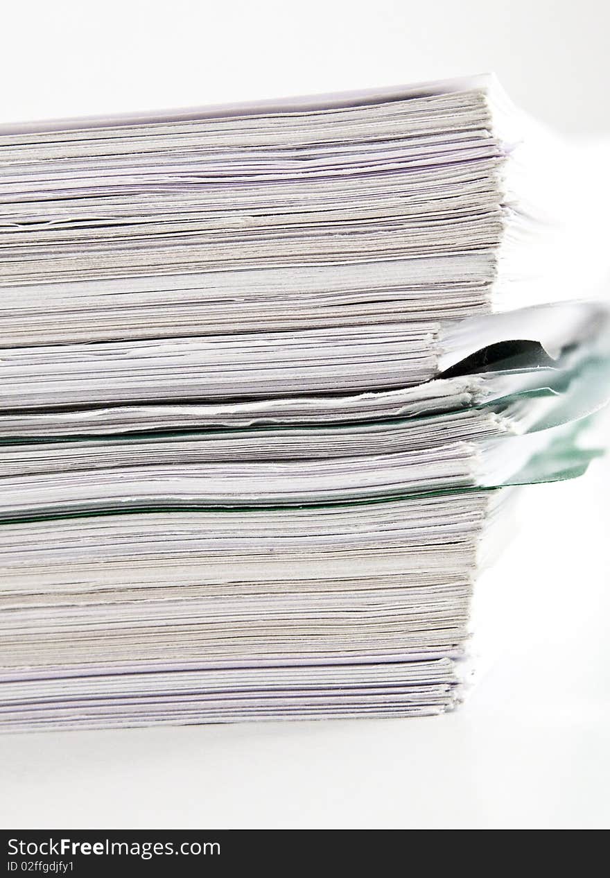 Files stack handled documents for review. Files stack handled documents for review