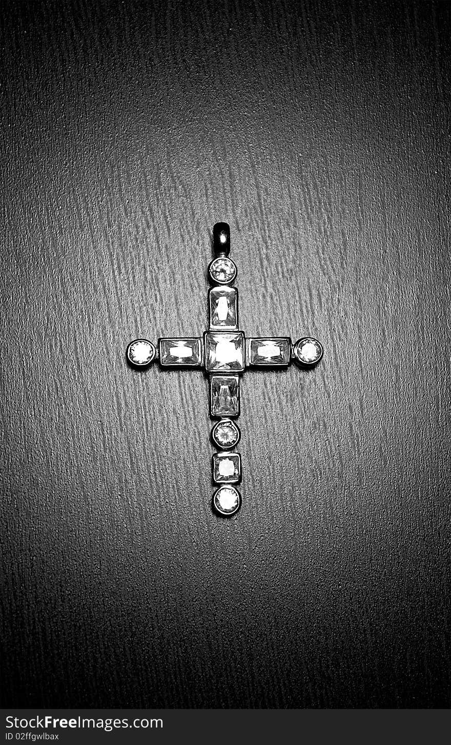 Cross with gems in the spotlight