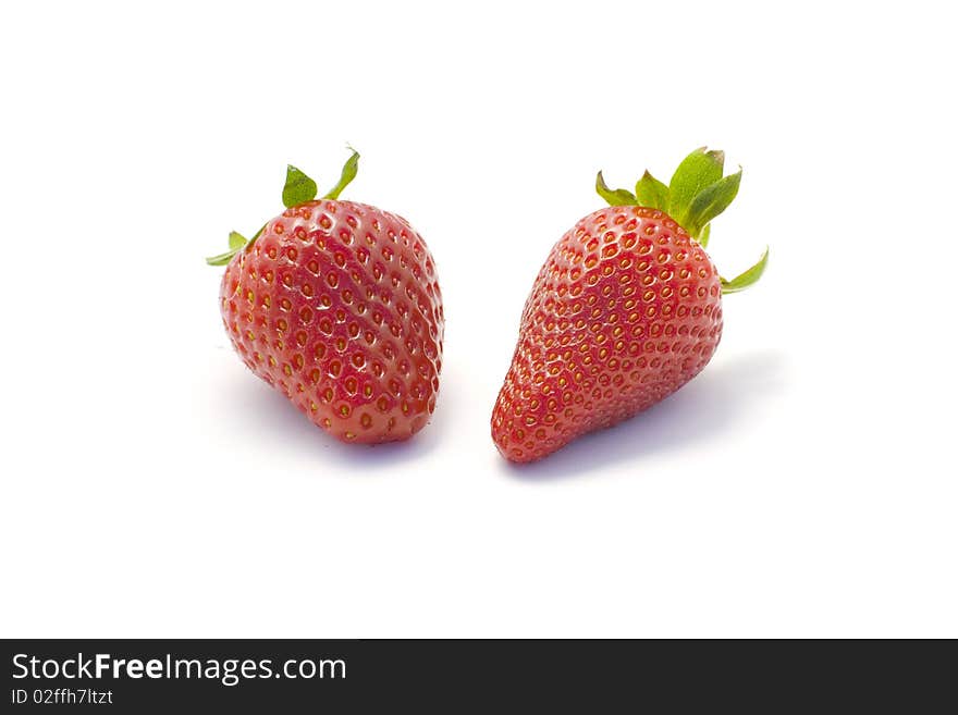 Studio shot of two fruits - strawberries cutout on white background. Studio shot of two fruits - strawberries cutout on white background