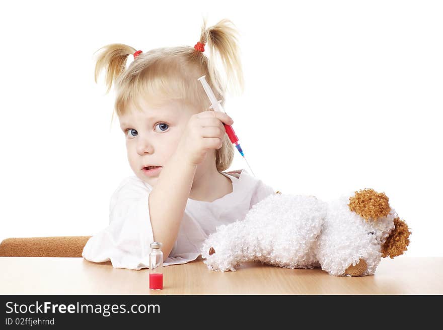 Child playing as a doctor with syringe