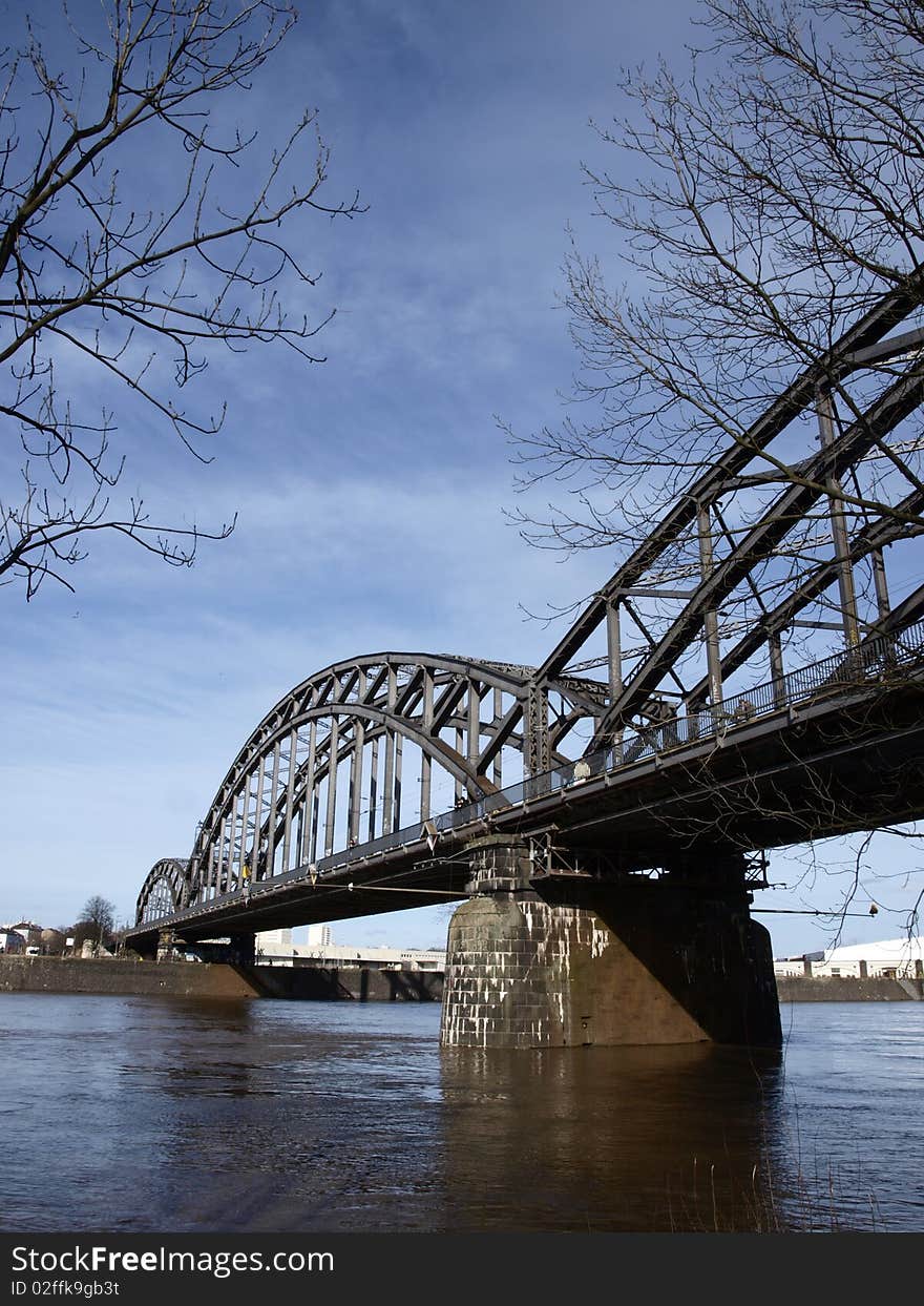 Train bridge over river during daylight