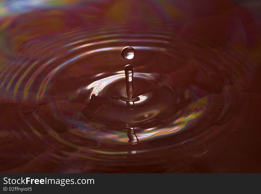 Red water drop with ripples