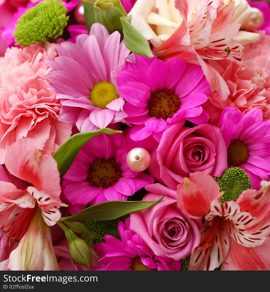 A flower bouquet with a lot of different flowers. A flower bouquet with a lot of different flowers